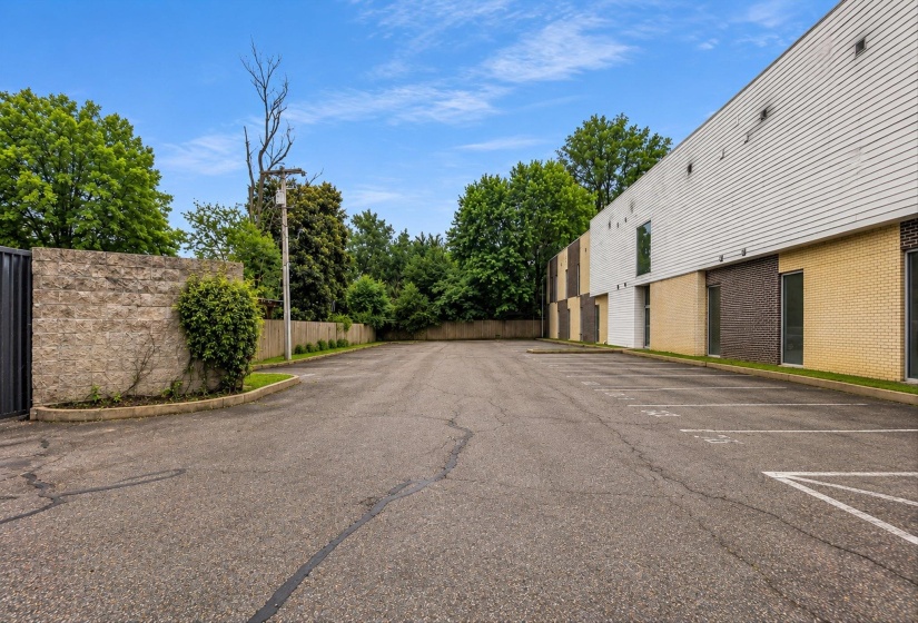 Spacious asphalt parking area with designated spaces
