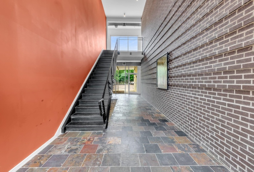 Multi-colored slate tile flooring in a running bond pattern