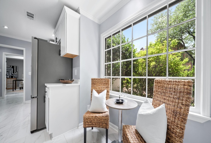 Expansive multi-pane window with bright garden outlook