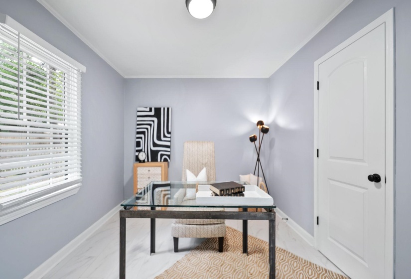 Interior space featuring light-colored walls and wood-finish flooring