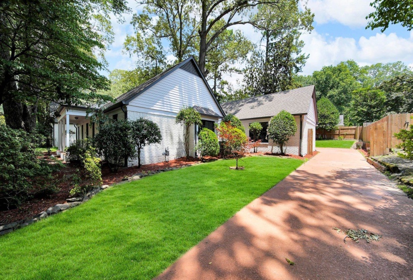 View of front of home featuring brick siding and driveway