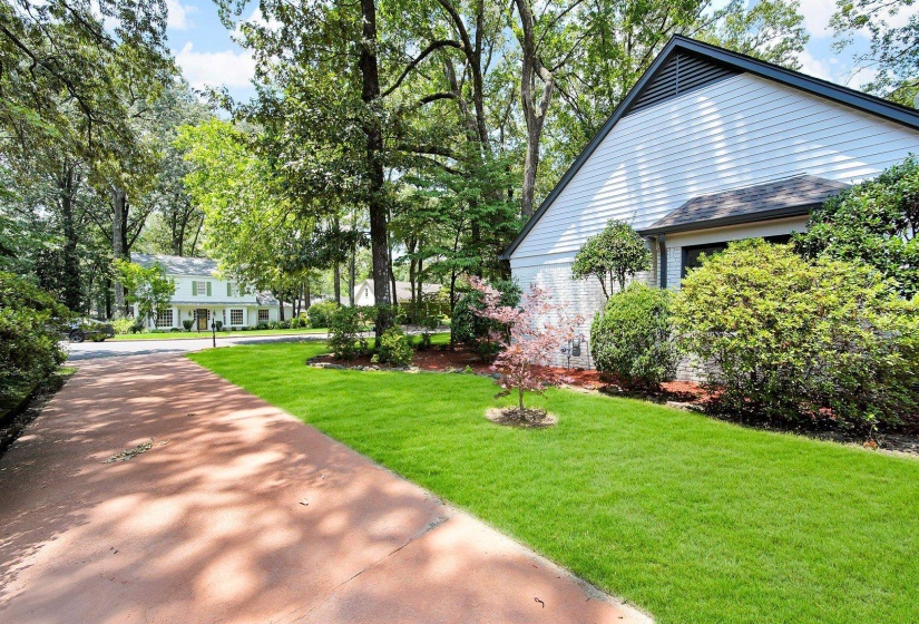 View of property exterior with a yard