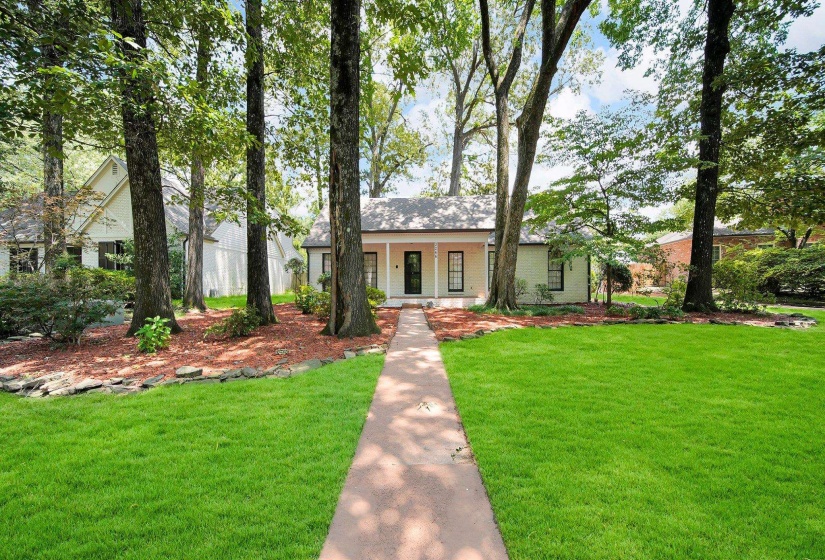 View of front of house featuring a front yard and a porch