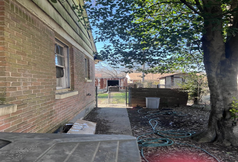 View of patio with a gate