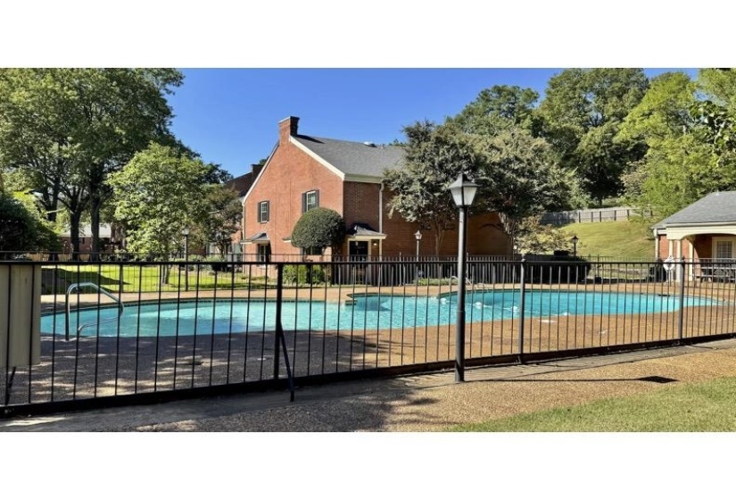 Community pool with a patio area