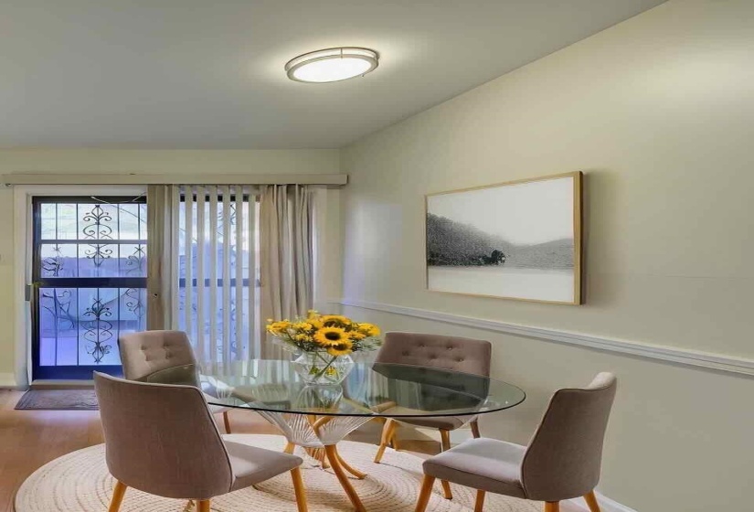 Dining space featuring wood finished floors and baseboards