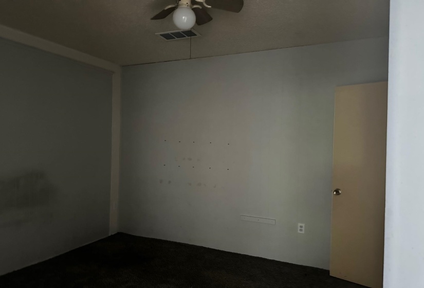 Unfurnished room with ceiling fan and carpet floors