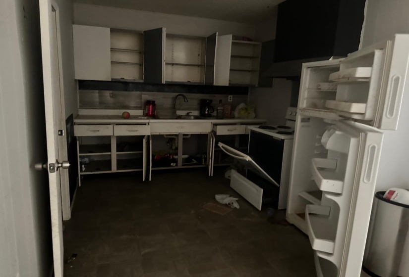 Kitchen with sink and white electric stove