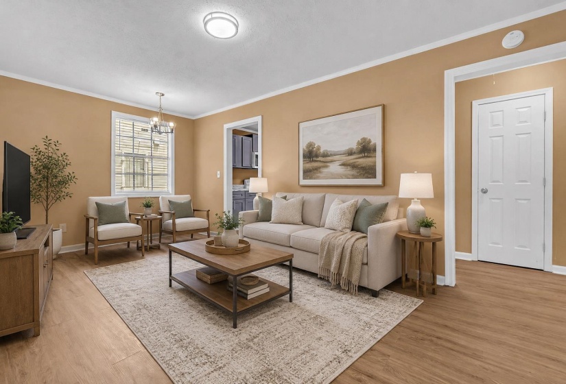 Living area featuring wood-finish flooring, a contemporary ceiling light fixture, a window with natural light, and a paneled interior door