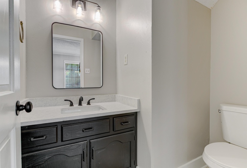 Bathroom featuring toilet and vanity