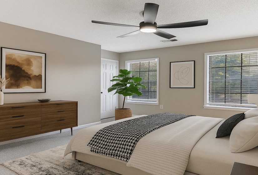 Carpeted bedroom featuring a textured ceiling and a ceiling fan