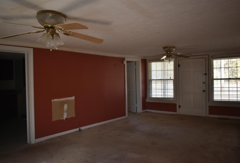 Spare room with ceiling fan and carpet flooring