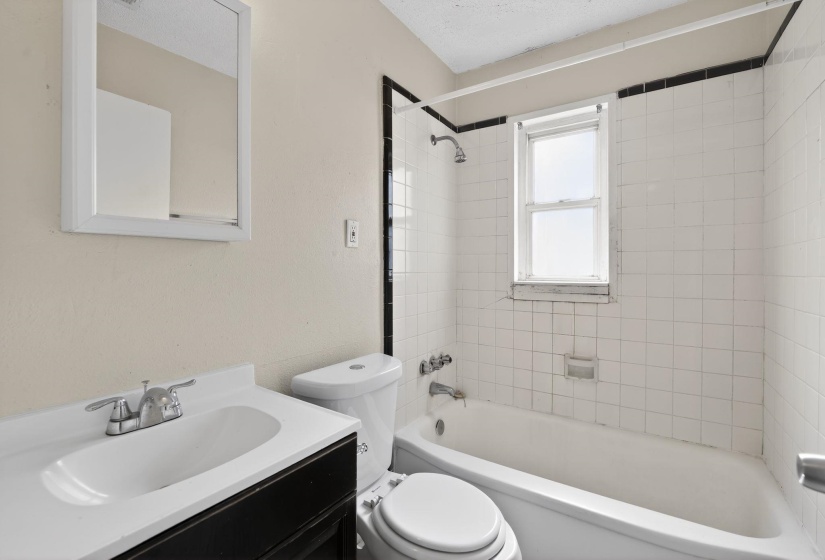 Full bathroom featuring vanity and shower / tub combination