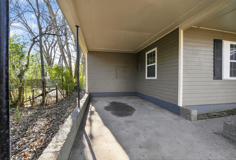 View of patio / terrace with a carport