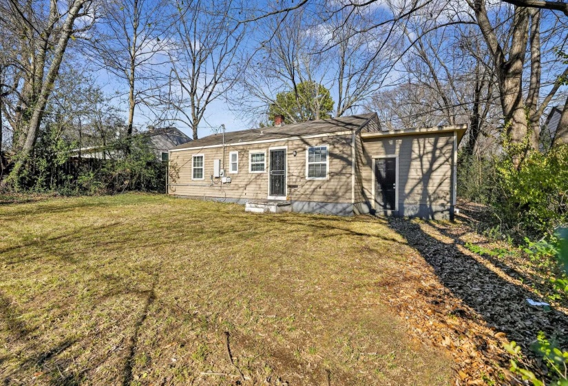 Single story home featuring a front yard and a chimney