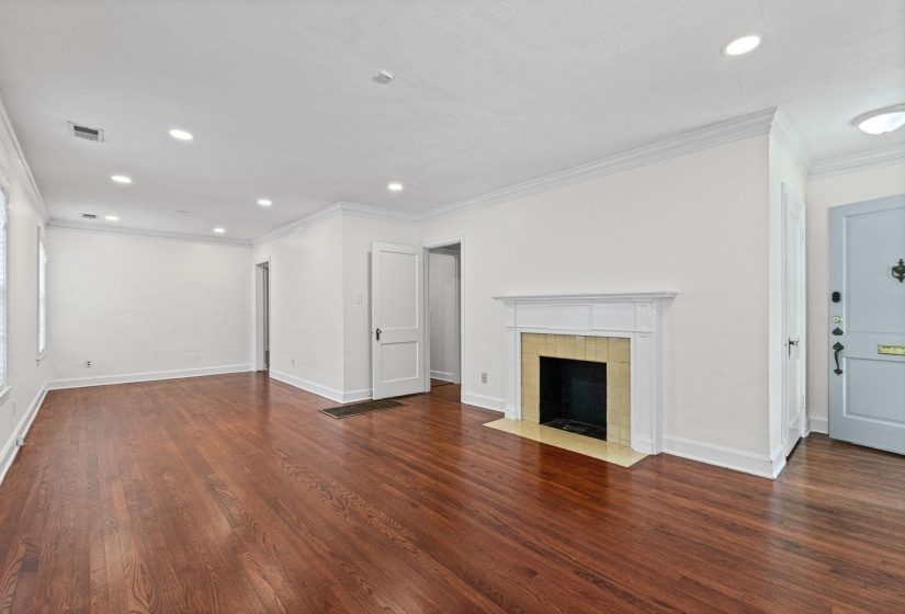 Open concept room featuring wood-finish flooring, recessed lighting, and crown molding