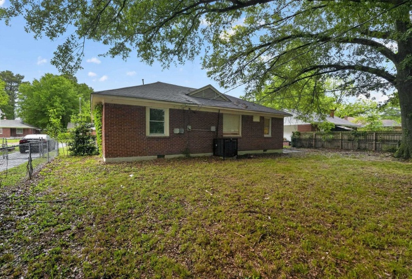 Back of property with brick siding