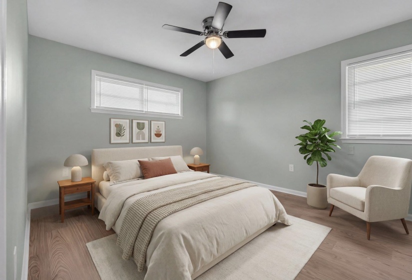 Spacious room featuring wood-finish flooring, a contemporary ceiling fan with integrated lighting, and light-toned walls