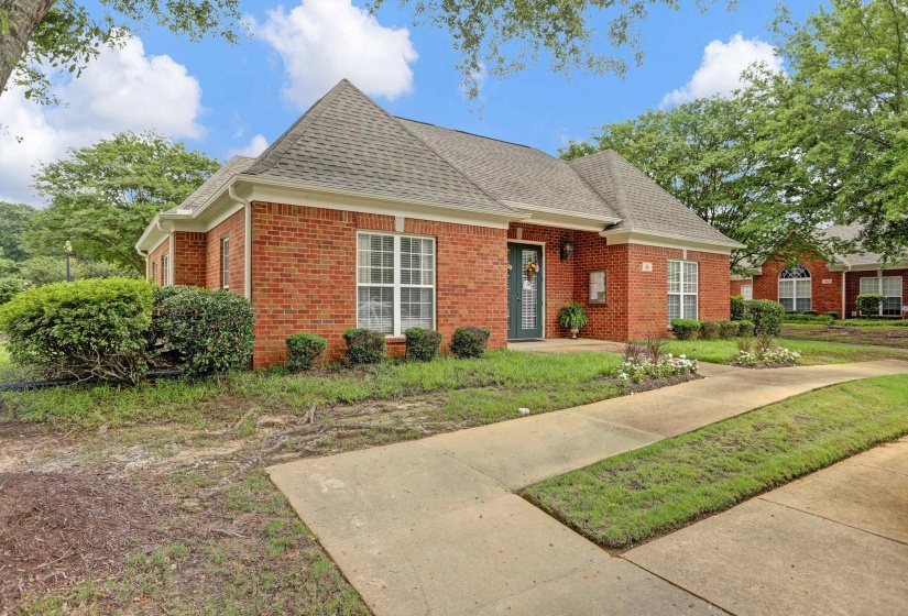 Brick exterior with a gabled roof and white trim
