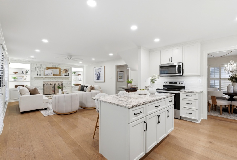 Open-concept living space featuring wood-finish flooring