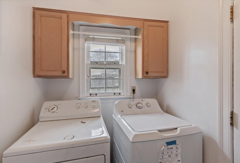 Laundry room with cabinet space and washing machine and clothes dryer