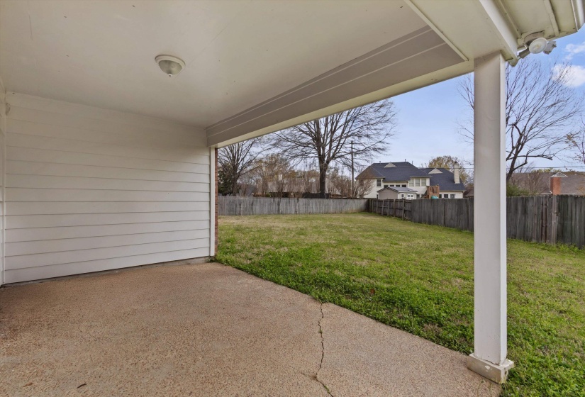 Fenced backyard featuring a patio
