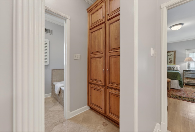 Built-in wood-finish cabinetry providing ample storage, set against light gray walls with white trim