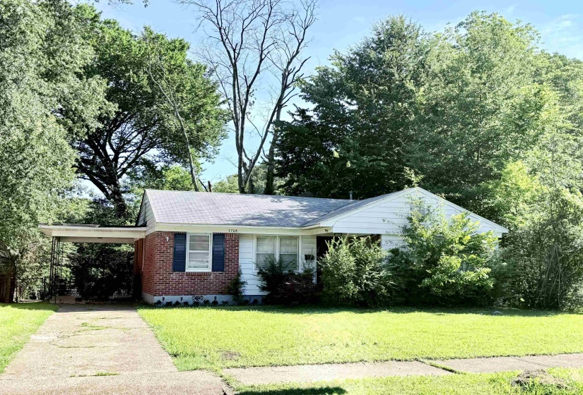 Brick and siding exterior with a gabled roofline