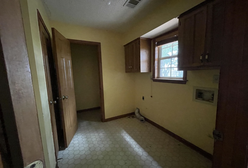 Laundry room with half bath