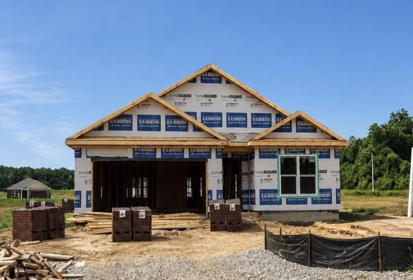 Newly constructed residence featuring a prominent front facade, multiple gables, and durable sheathing