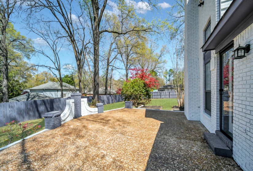 Fenced backyard with a patio area