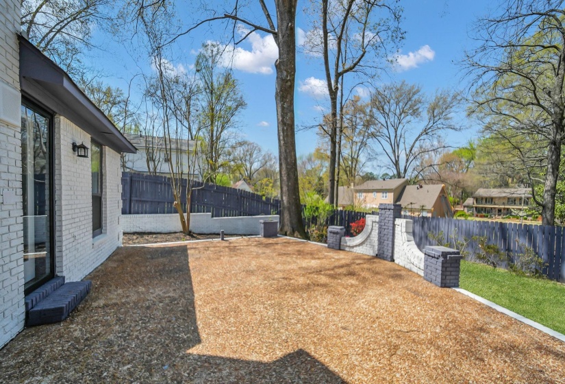 Fenced backyard with a residential view