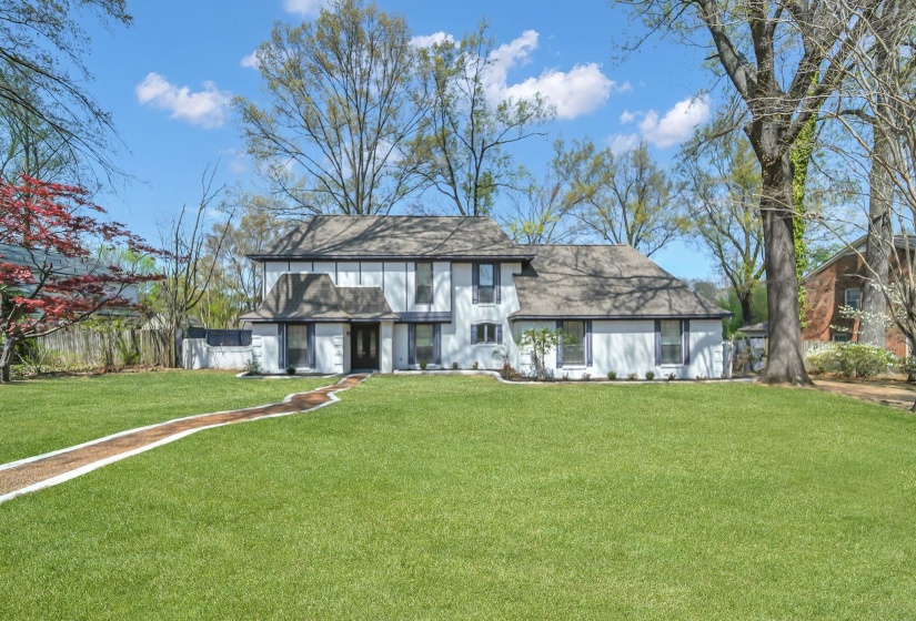 English style home featuring roof with shingles