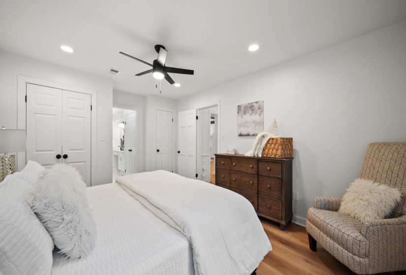 Bright interior with recessed lighting, wood-finish flooring, and a ceiling fan