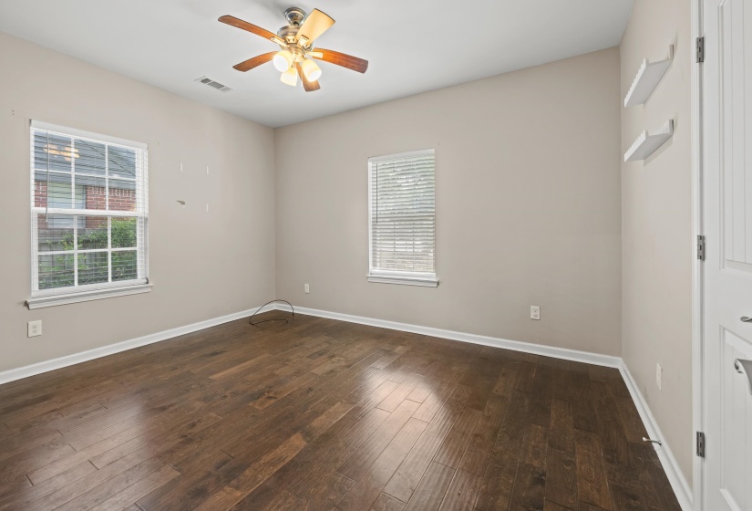 Warm wood-finish flooring complemented by neutral wall tones