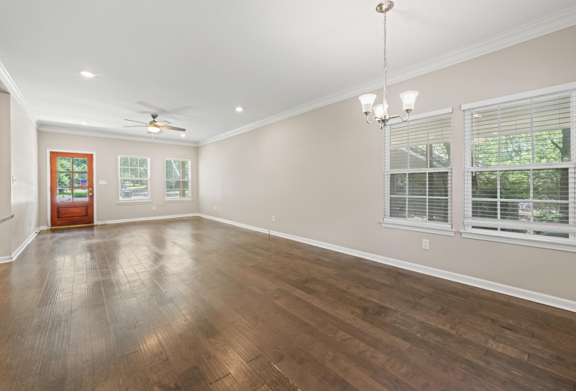 Expansive interior space featuring wood-finish flooring, recessed lighting, and a ceiling fan