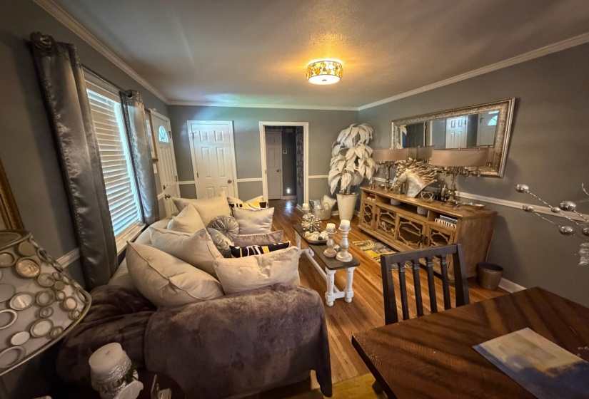 Hardwood flooring throughout this living space
