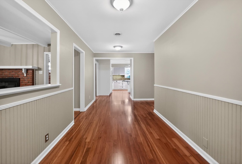 Hardwood flooring extends through this interior hallway