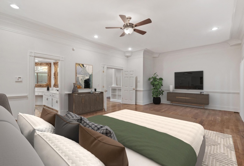 Spacious room featuring wood-finish flooring and crown molding