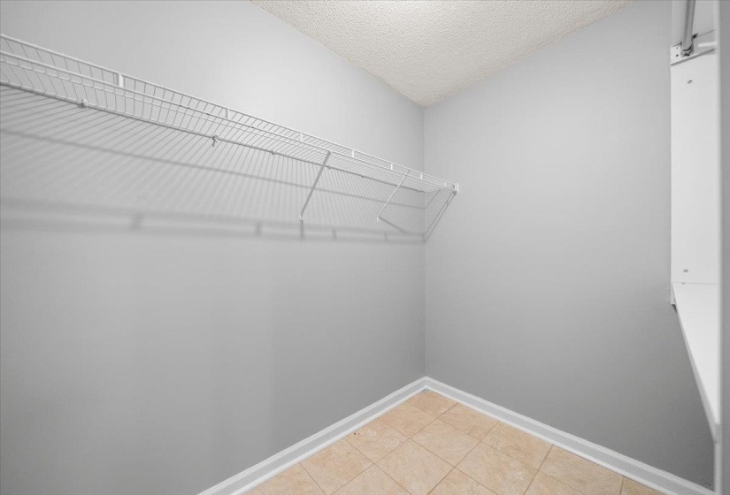 Interior storage space featuring wire shelving and neutral wall color