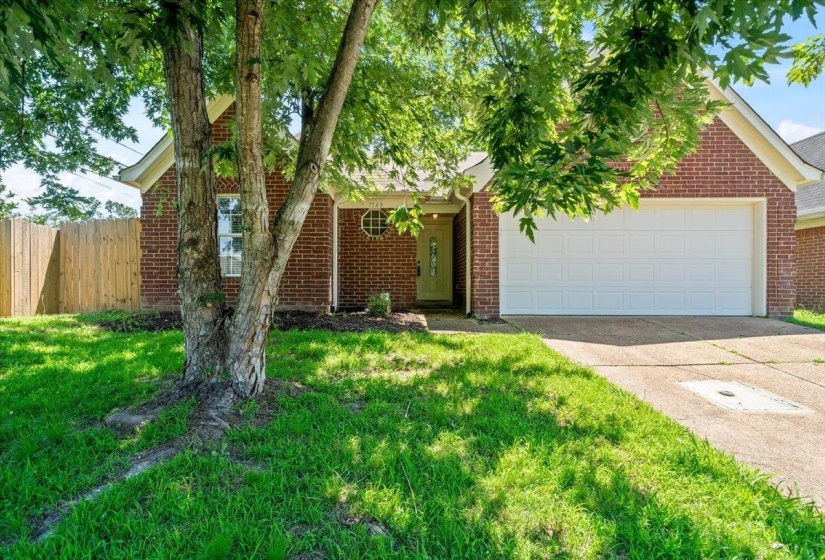 Brick exterior with an attached two-car garage