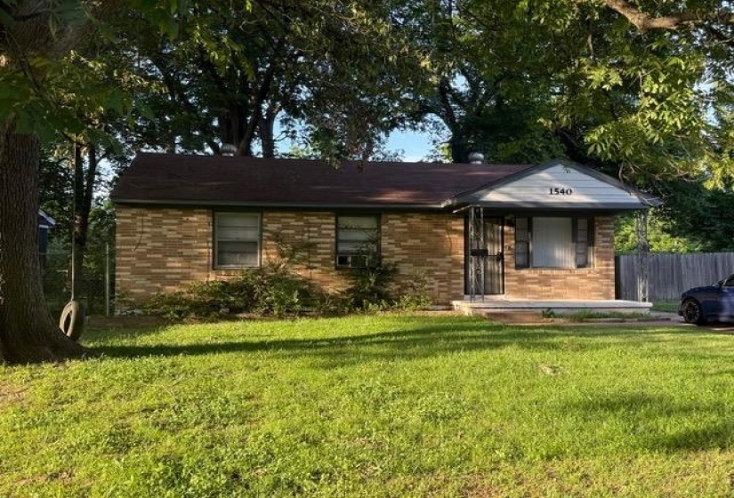 Brick exterior with a covered porch entry