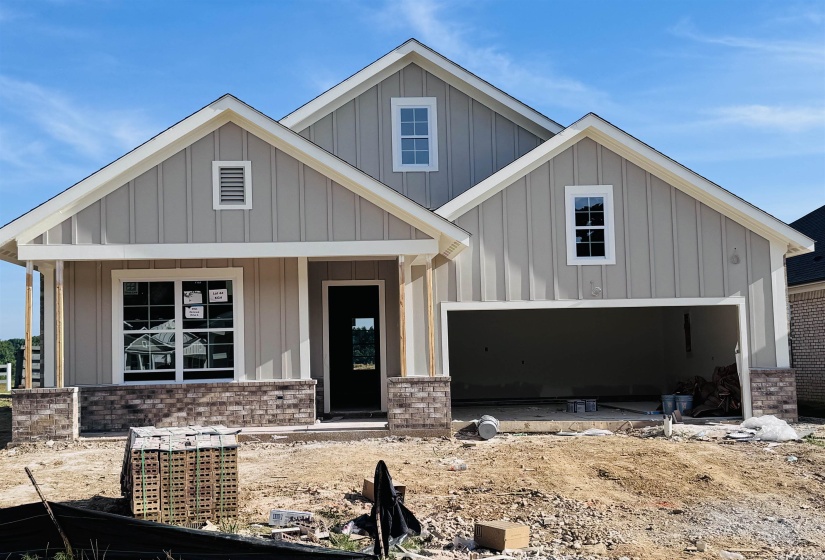 Single-story residence featuring light gray board-and-batten siding and white trim