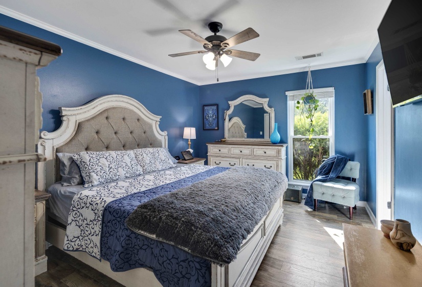 Spacious room w/ a large window with natural light & full bathroom
