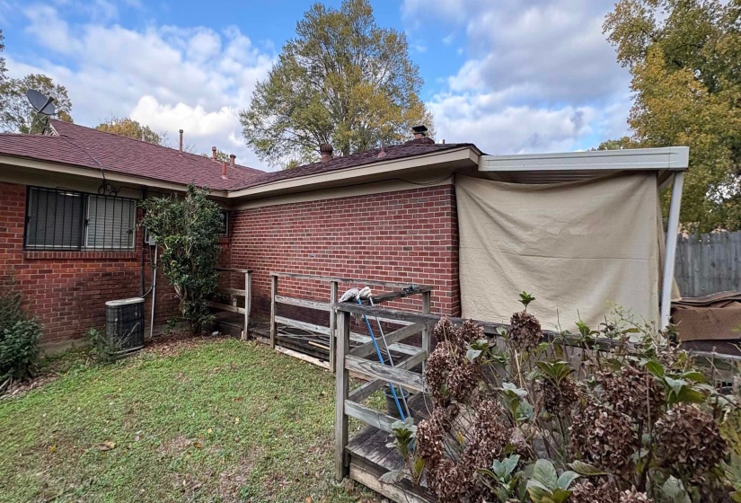 Back of house with brick siding