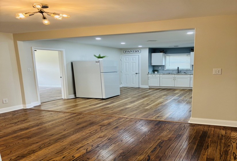 Unfurnished living room featuring light wood finished floors and recessed lighting
