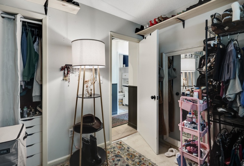 Built-in closet system with shelving and hanging rods