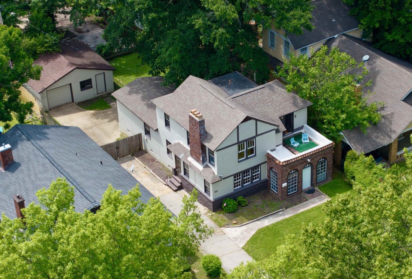 Tudor-style exterior with a prominent brick chimney
