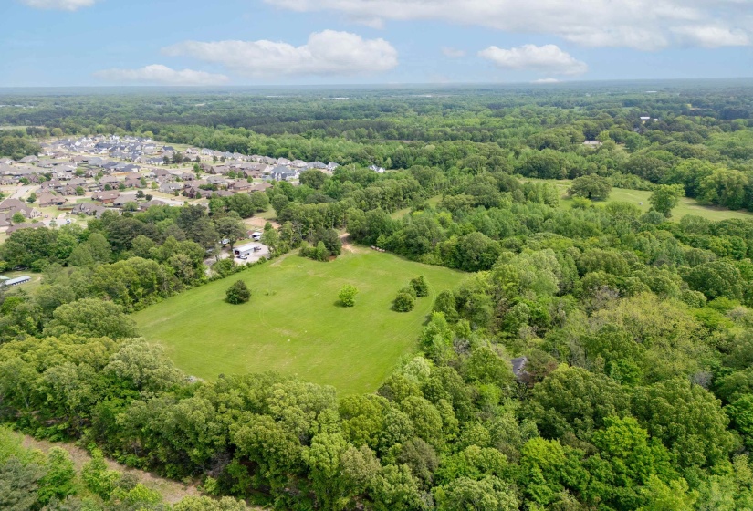 Aerial view featuring a residential view and a forest view