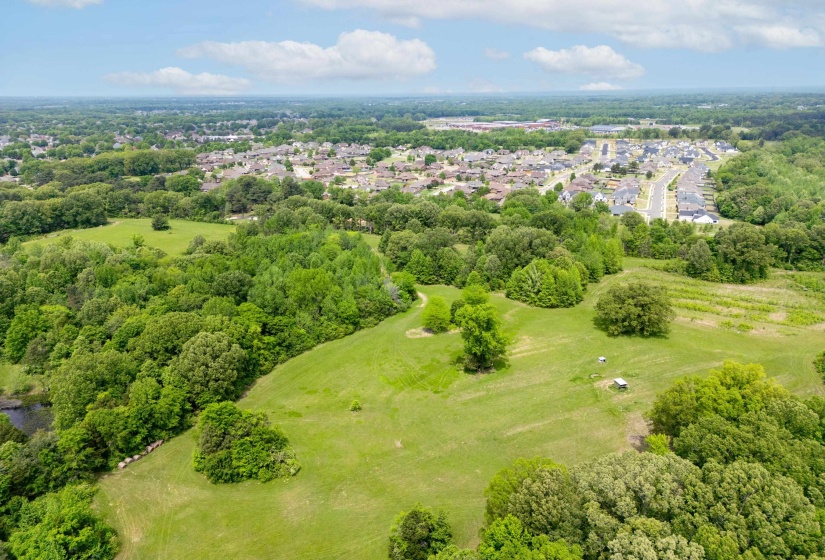 Birds eye view of property featuring golf course view